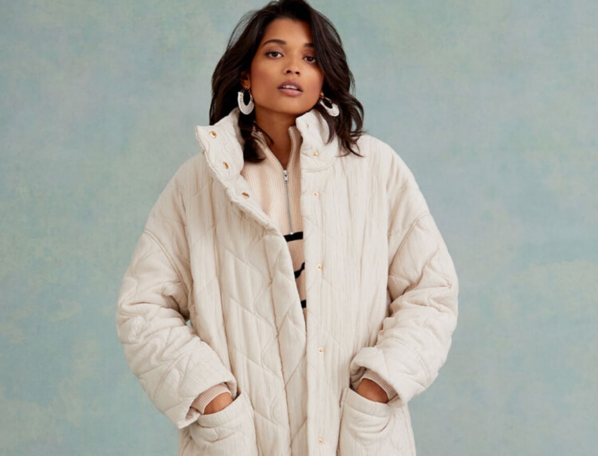 Woman wearing a cream coat