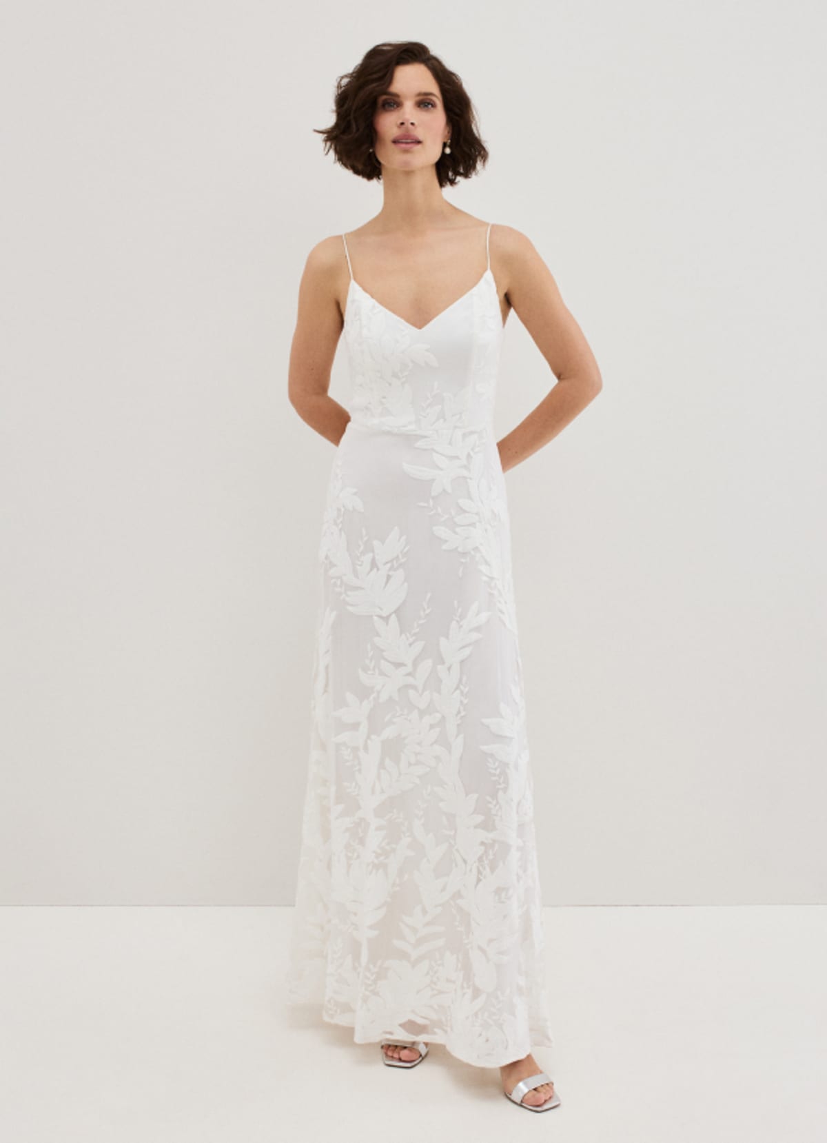 Woman wearing Phase Eight bridal dress
