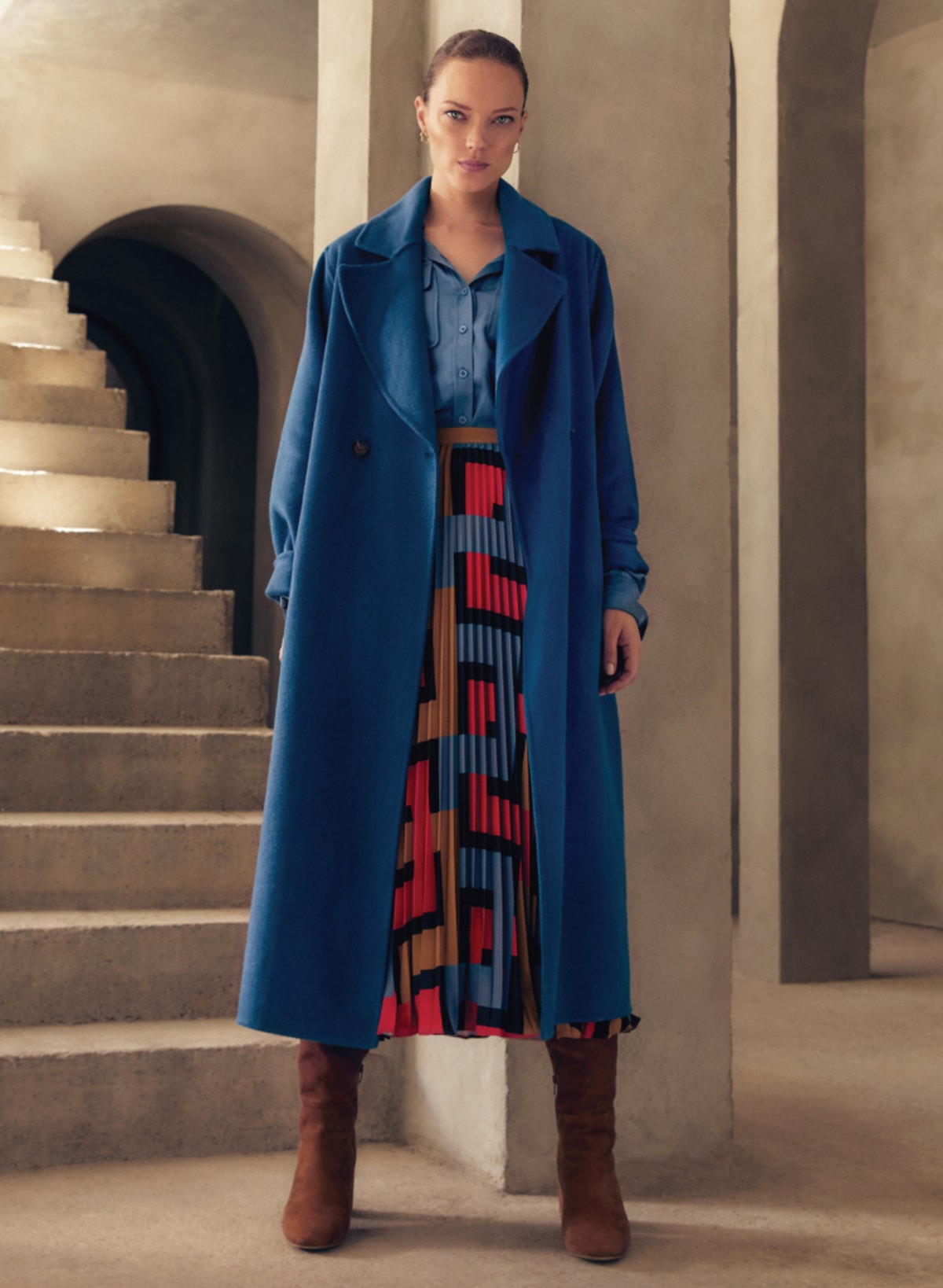 Woman wearing Phase Eight teal coat