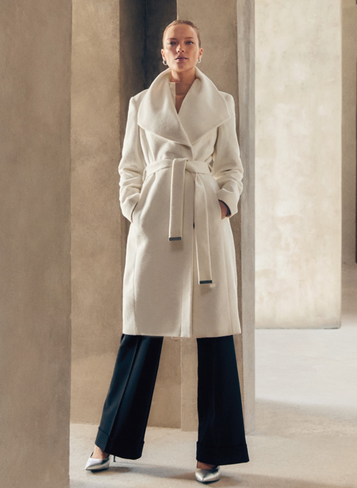 Woman wearing Phase Eight white coat