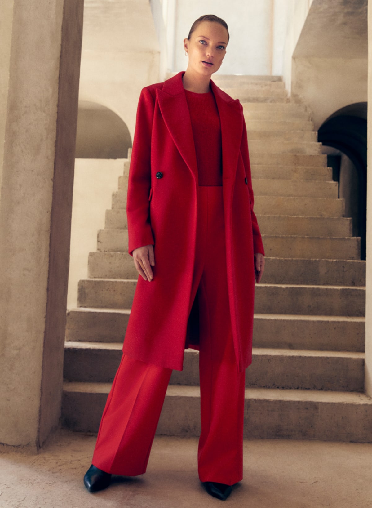 Woman wearing Phase Eight red coat