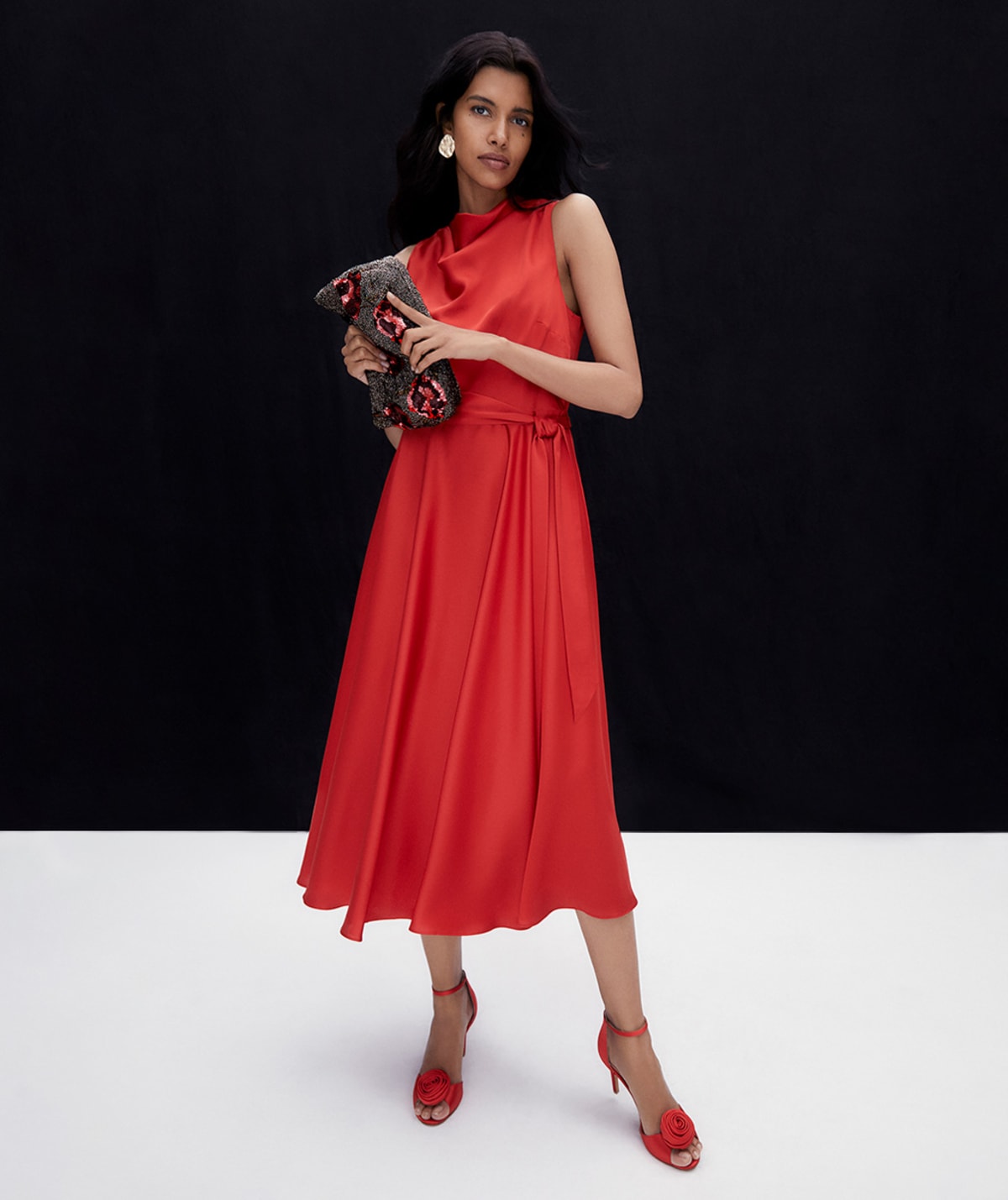 Woman wearing Phase Eight red dress