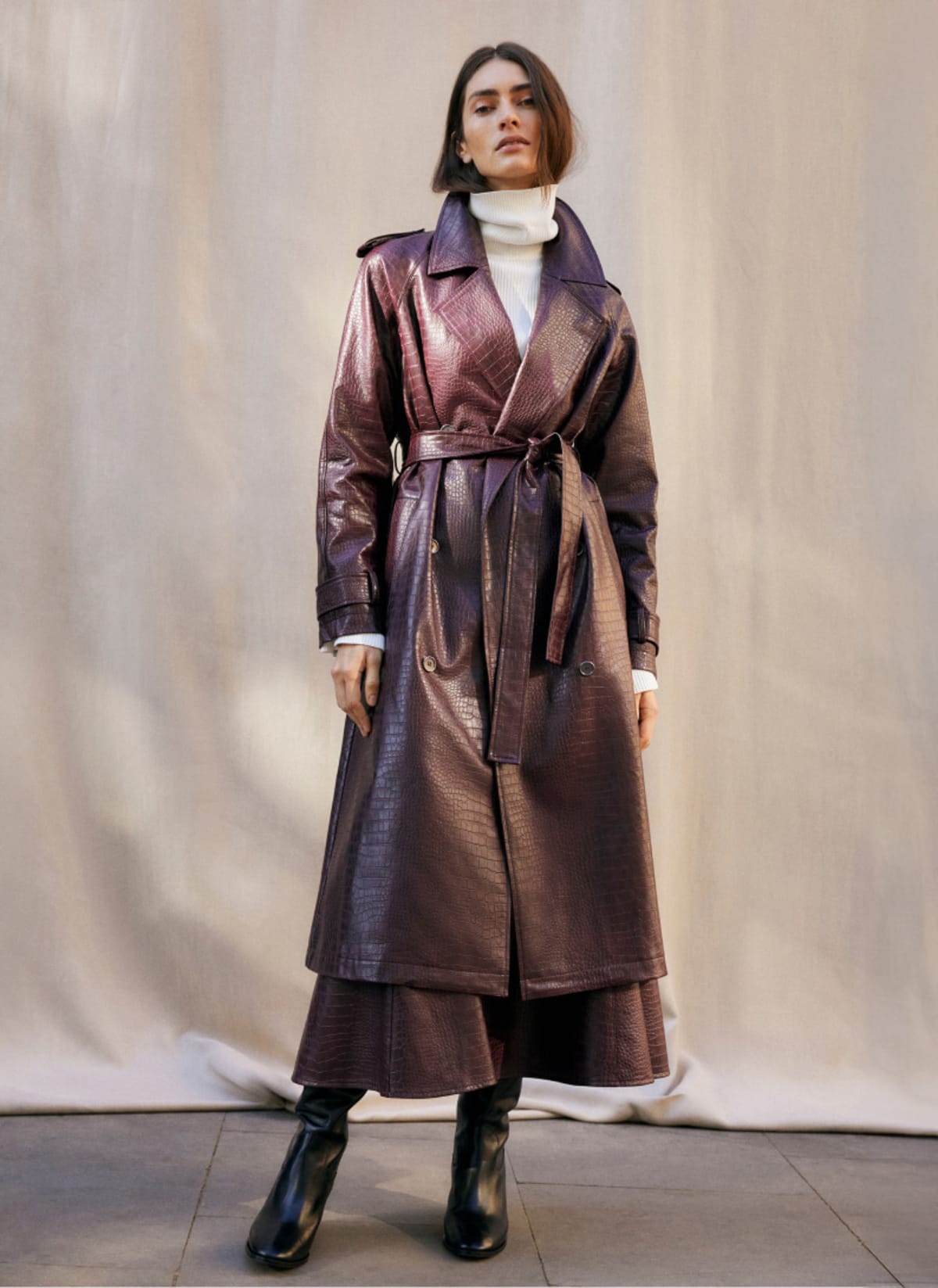 Woman wearing Phase Eight faux leather croc coatt