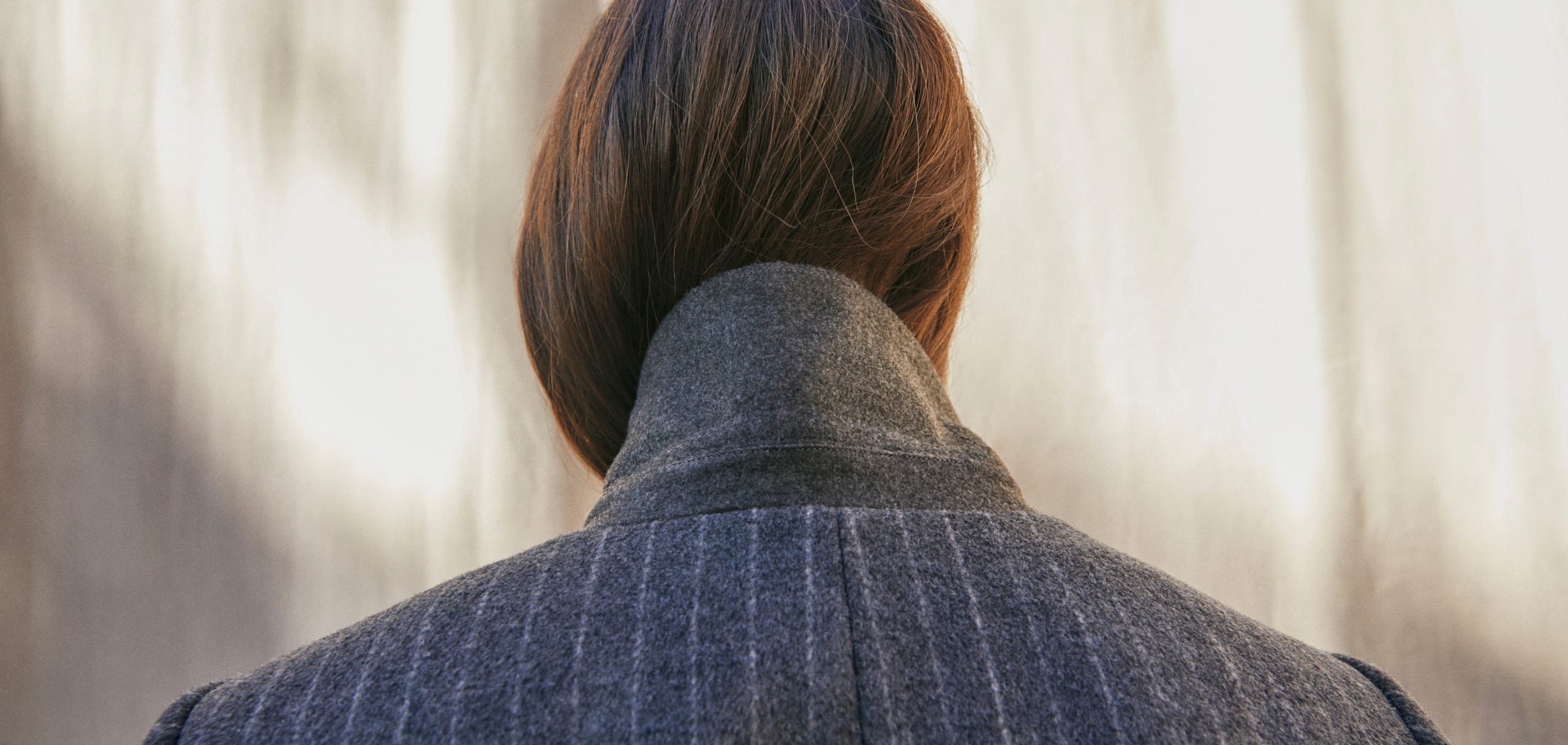 Woman wearing Phase Eight pinstripe coat