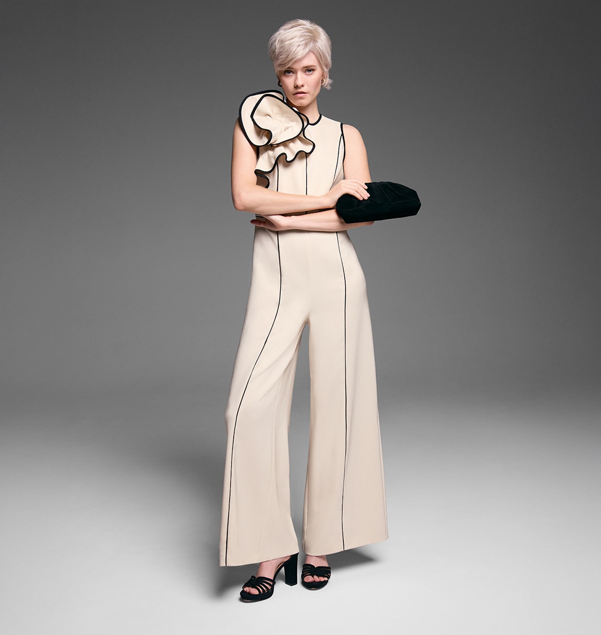 Woman wearing Phase Eight limited edition event jumpsuit