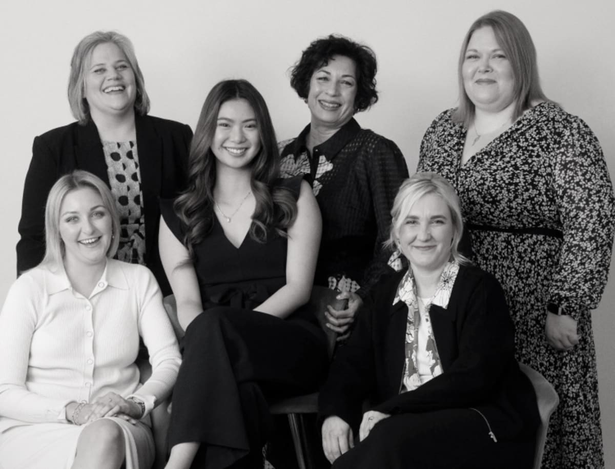 Six women wearing Phase Eight