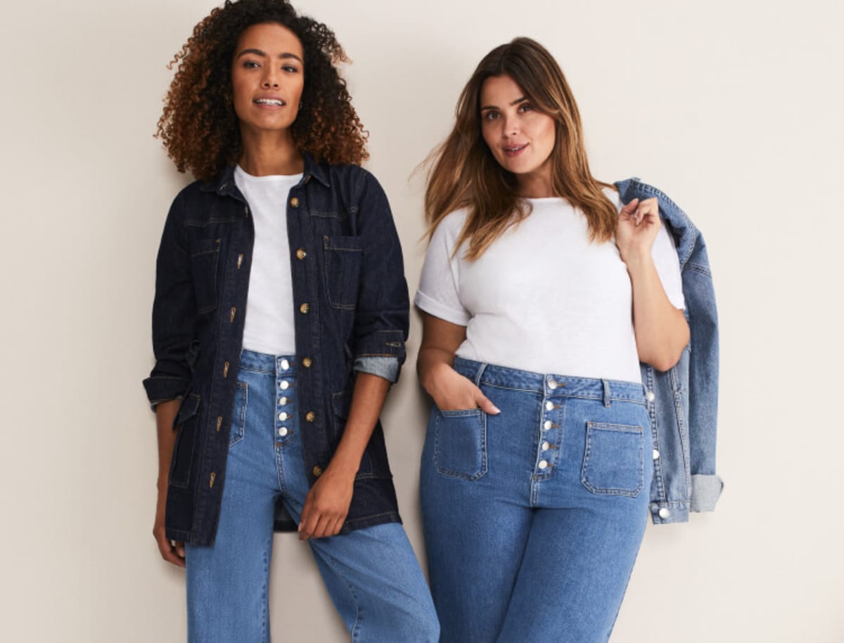 Woman wearing denim jacket and jeans, woman wearing white top and jeans