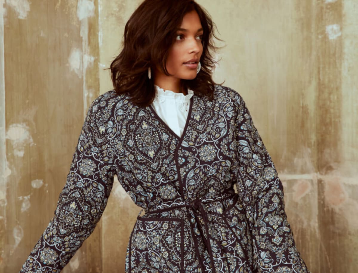 Woman wearing paisley print coat