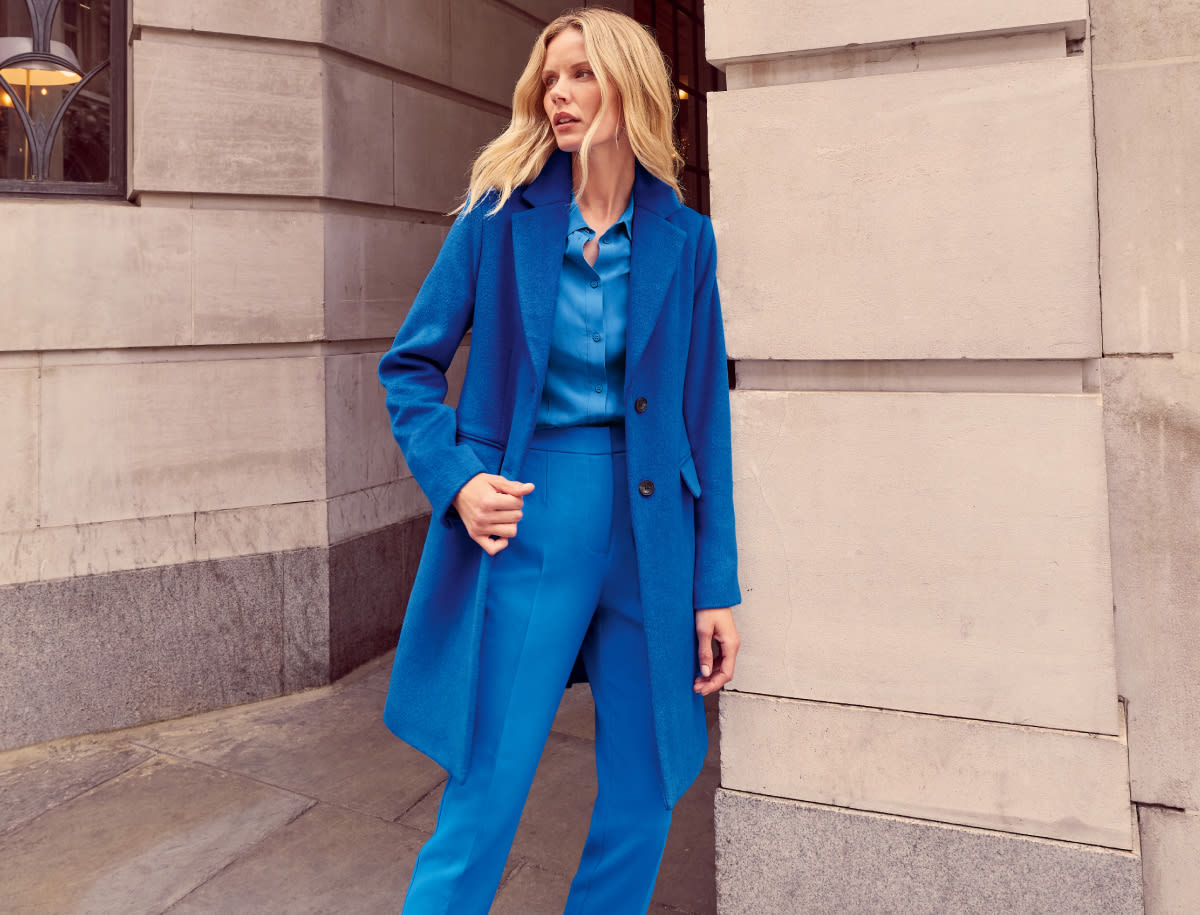 Woman wearing Phase Eight blue suit