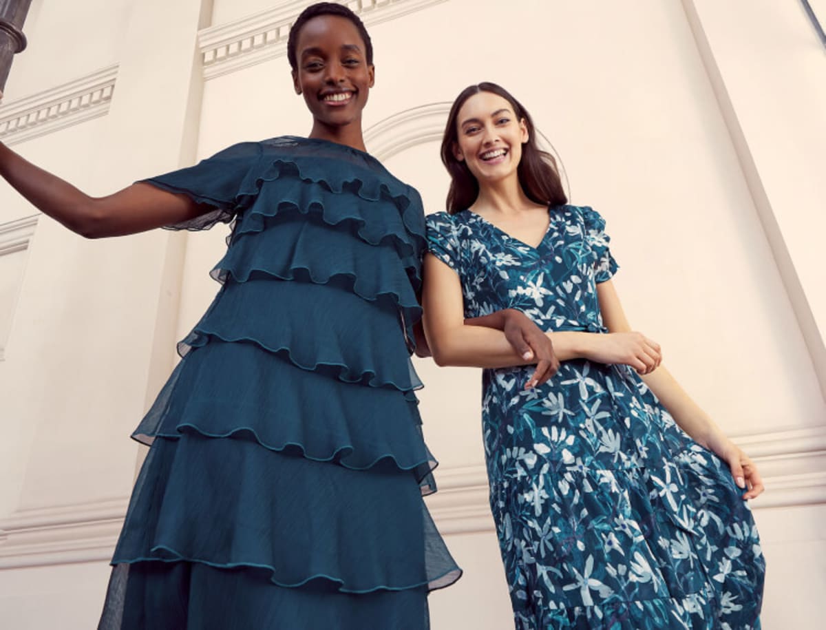 Woman wearing blue ruffled dress, woman wearing floral dress